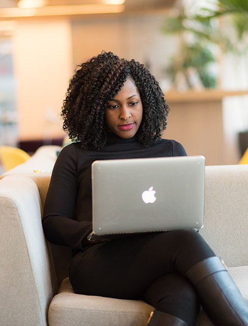 woman looking at a laptop